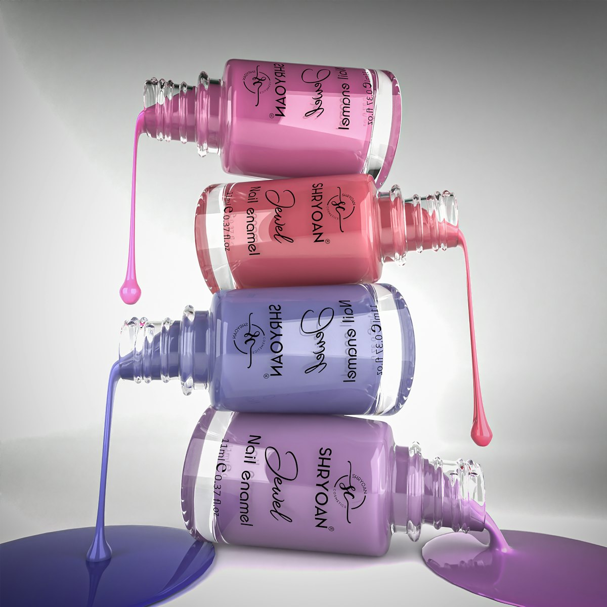 Stacked nail polish bottles in pink and lilac